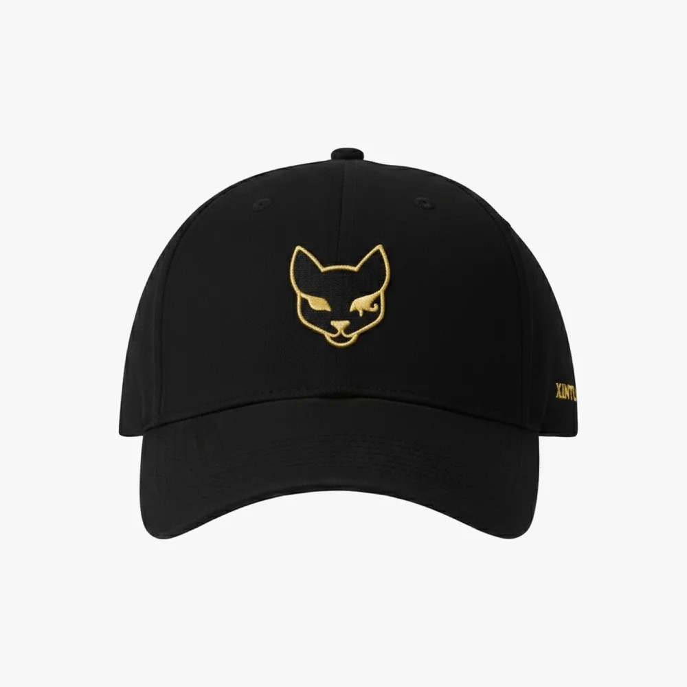Front view of the black Xintu cap with the gold cat mark