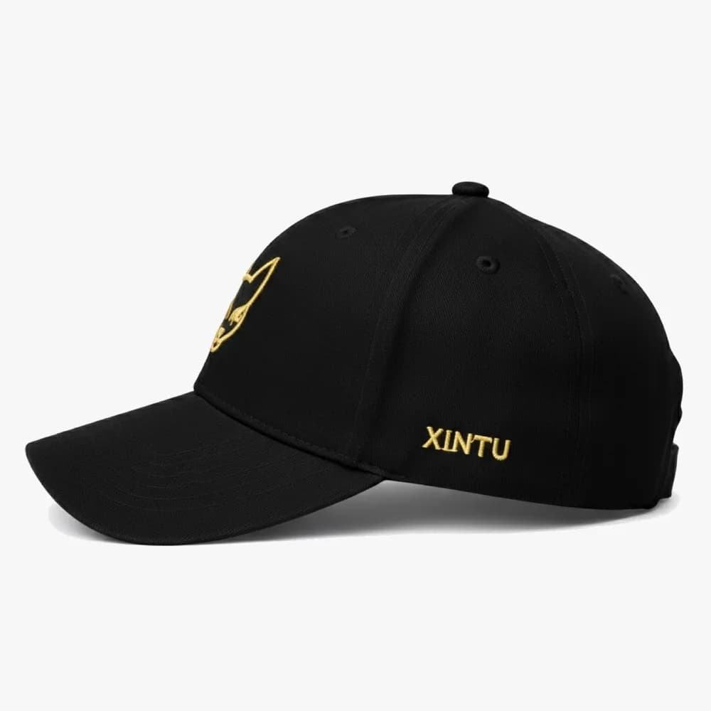 Side view showing the XINTU wordmark embroidered in gold on the panel